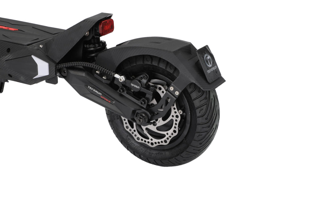 Close-up of a black electric scooter wheel on a white background