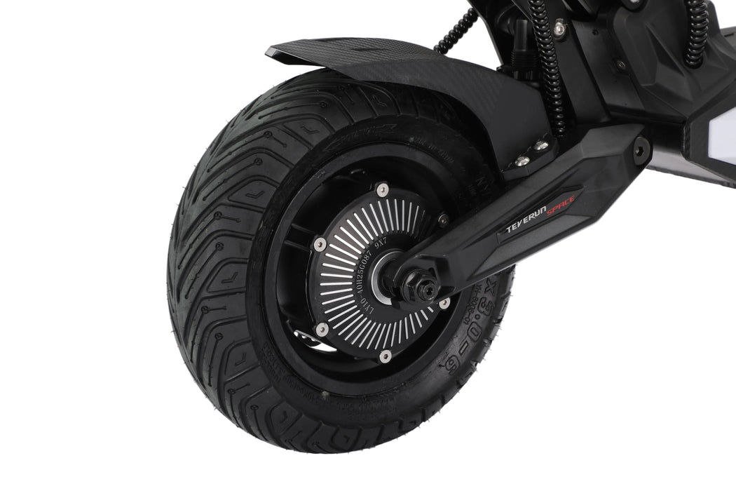 Close-up of a black electric scooter wheel on a white background